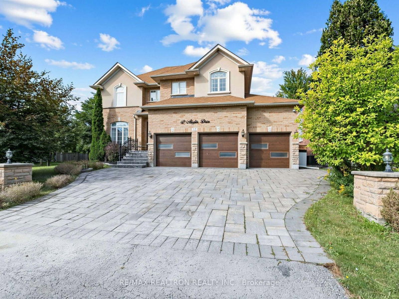 The three-car-garage detached home at 12 Anglin Drive