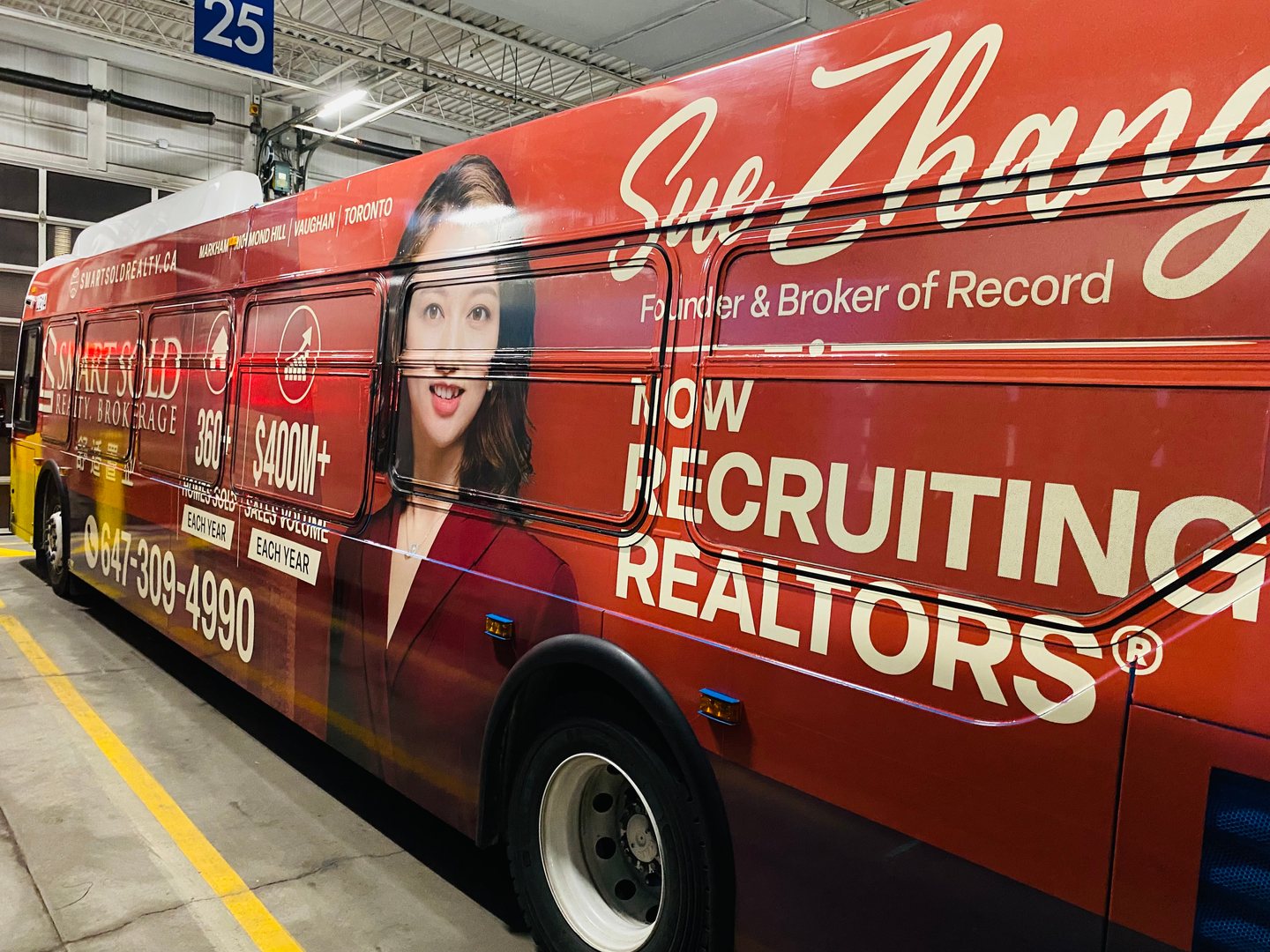 Full Side advertisement on a York Region Transit bus featuring Sue Zhang’s portrait and Smart Sold Realty branding.